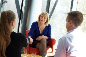 The Victorian Small Business Commissioner, Ms Judy O'Connell, meeting and shaking hands with small business people.